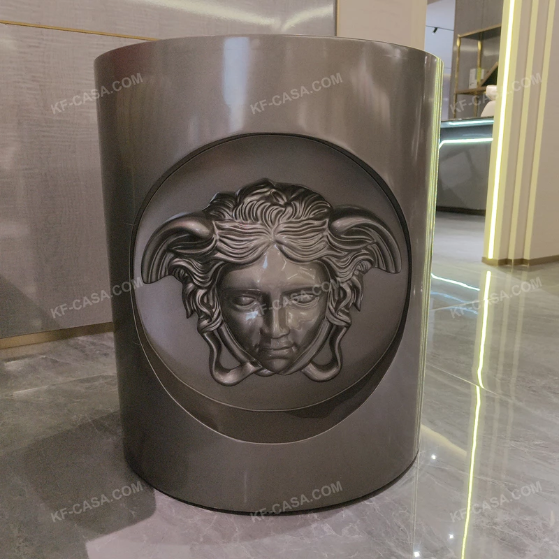 Sculptural Cylindrical Sofa Side Table with Brushed Stainless Steel Body and Raised Classical Face Relief